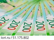Close up of new Russian currency. Banknotes nominal 200 rubles. Russian paper cash money backgroung. Стоковое фото, фотограф Denis Vostrikov / Фотобанк Лори