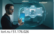 A person engages with augmented reality technology in a contemporary office space. Стоковое AI-видео, аниматор Данила Большаков / Фотобанк Лори