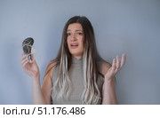 Worried woman looking at hairbrush full of strands concerned about hair loss and thinning hair problem. Стоковое фото, фотограф Svetlana Golovco / Фотобанк Лори