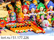 Gorodets, Russia - June 23rd, 2018. Traditional handicraft wooden souvenirs at street gift store near complex "City of Craftsmen" on the banks of the Volga River. Редакционное фото, фотограф Denis Vostrikov / Фотобанк Лори
