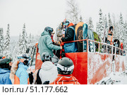 Sheregesh, Russia, 4 January 2021, Snowboarder, skier load ski equipment snowcat. Редакционное фото, фотограф Spirit River / Фотобанк Лори