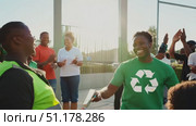 People gather joyfully in an urban park, celebrating their achievements in recycling and environmental awareness as the sun sets. Стоковое AI-видео, аниматор Данила Большаков / Фотобанк Лори
