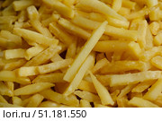 Golden french fries background. Fast food. Стоковое фото, фотограф Маргарита Кирьякова / Фотобанк Лори