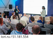 People attending a presentation at a professional seminar or business event meeting. Стоковое фото, фотограф Антон Гвоздиков / Фотобанк Лори