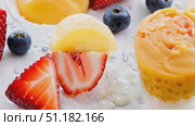 Enjoy a step-by-step guide to creating a refreshing summer dessert with colorful sorbets and fresh strawberries and blueberries. Стоковое AI-видео, аниматор Данила Большаков / Фотобанк Лори