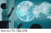 A professional explains key global trends while pointing at an interactive map in a sleek conference room setting. Стоковое AI-видео, аниматор Данила Большаков / Фотобанк Лори
