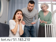 Family quarrel - wife cries after husband and elderly mother screams. Стоковое фото, фотограф Яков Филимонов / Фотобанк Лори