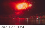 Fireworks with colorful lights over sea. Стоковое видео, видеограф Михаил Коханчиков / Фотобанк Лори