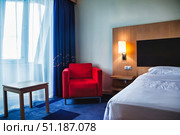 Quiet Morning at the Hotel Room, Red Chair and White Sheets. Стоковое фото, фотограф Aleksandr Golubev / Фотобанк Лори