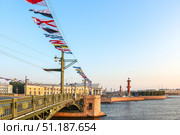 Saint-Petersburg, Russia - July 28th, 2018. International maritime signal flags are waving on wind under blue cloudy sky. Редакционное фото, фотограф Denis Vostrikov / Фотобанк Лори