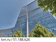 Bottom view of modern glass skyscraper, Ritz-Carlton hotel, Kazakhstan, Almaty. Редакционное фото, фотограф Ирина Кононова / Фотобанк Лори