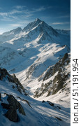Beautiful Snowy Mountain Landscape Under a Clear Blue Sky With Clouds Hovering in the Background. Стоковое AI-изображение, AI-художник Юлия Гапеенко / Фотобанк Лори