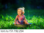 A child bathes in a basin in nature. Sunset. Стоковое фото, фотограф Наталия Кирсанова / Фотобанк Лори