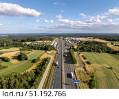 Trucks driving on German autobahn a9 near Pegnitz in Bavaria, aerial view. Стоковое фото, фотограф Данил Руденко / Фотобанк Лори