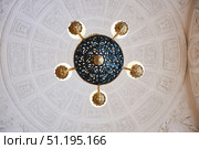 St. Petersburg, Russia - May 27, 2021: Hermitage Museum, large chandelier with gilding for hall lighting. Palace interior details. Редакционное фото, фотограф Наталия Кирсанова / Фотобанк Лори