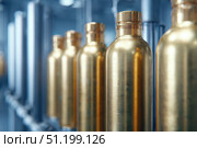 Brass oxygen tanks. Bundle of gas cylinder and high pressure gauges, meter, valve. Many argon cylinders with compressed gas for industry, welding. Fuel manufacturing. Liquefied gas production, factory. Стоковое AI-изображение, AI-художник Марина Демидюк / Фотобанк Лори