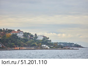 ISTANBUL, TURKEY - NOVEMBER 26, 2021: Building on the Princes' Islands, view from the ship. The Sea of Marmara. Редакционное фото, фотограф Наталия Кирсанова / Фотобанк Лори