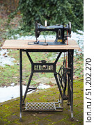 Krasnodar, Russia. - January 29, 2024: Vintage vintage Minerva mechanical sewing machine on a wrought iron table. Редакционное фото, фотограф Наталия Кирсанова / Фотобанк Лори