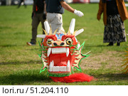 DIEPPE, FRANCE - SEPTEMBER 15, 2022: Kite festival. Head of the Dragon kites. Редакционное фото, фотограф Irina Kuchugurina/Gaudy / Фотобанк Лори