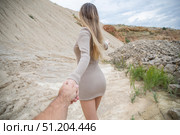Follow me. Young attractive woman holding a mans hand. Стоковое фото, фотограф Андрей Аркуша / Фотобанк Лори