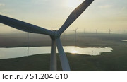 Windmills or wind turbine in morning light. Стоковое видео, видеограф Михаил Коханчиков / Фотобанк Лори