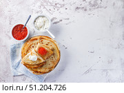 Stack of russian pancakes blini with red caviar, fresh sour cream. Стоковое фото, фотограф Ирина Буракова / Фотобанк Лори