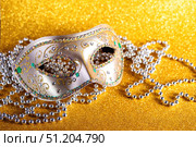 Festive, colorful Mardi Gras or carnivale mask on golden background. Venetian masks. Стоковое фото, фотограф Ирина Буракова / Фотобанк Лори