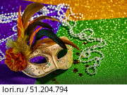 Festive, colorful Mardi Gras or carnivale mask on golden background. Venetian masks. Стоковое фото, фотограф Ирина Буракова / Фотобанк Лори