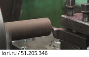 processing of cylindrical metal blanks on a factory lathe. Стоковое видео, видеограф Алексей Сергеев / Фотобанк Лори