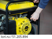 Portable gasoline generator.The use of an autonomous energy source. An additional source of energy. Стоковое фото, фотограф Александр Поташев / Фотобанк Лори