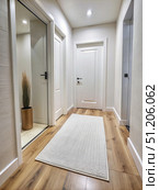 White Doorway With A White Rug Leading Into An Apartment. Generative AI. Стоковое AI-изображение, AI-художник Roman Zavorotny / Фотобанк Лори