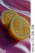 Freshly Cut Lemons on a Smooth Pink Surface Glisten Under Soft Light During a Vibrant Afternoon. Стоковое AI-изображение, AI-художник Юлия Гапеенко / Фотобанк Лори