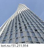 Twisted Skyscraper in Dubai Against Blue Sky. Стоковое фото, фотограф Лариса Потехина / Фотобанк Лори