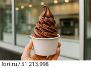 Indulge in a Deliciously Creamy Chocolate Soft Serve Ice Cream Cone, Swirled to Perfection with a Sprinkle of Chocolate Chips for an Extra Treat. Стоковое AI-изображение, AI-художник Башкирова Анна / Фотобанк Лори
