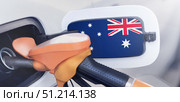 The flag of Australia on the hatch of the gas tank of a car at a gas station. Gasoline and diesel fuel in Australia. High prices for diesel fuel, gasoline and gas at gas stations in Australia. Problems with refueling a car in Canberra. Стоковое фото, фотограф Владимир Разгуляев / Фотобанк Лори