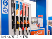 Russia, Krasnoyarsk, January 7, 2025: Gazprom Neft branded gas station with G Drive fuel. Fuel dispensers at a gas station showcasing various fuel options and prices for drivers in need of refueling. Редакционное фото, фотограф Владимир Разгуляев / Фотобанк Лори