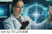 In a contemporary laboratory, a scientist analyzes a luminescent sample, surrounded by advanced technology and data displays. Стоковое AI-видео, аниматор Данила Большаков / Фотобанк Лори