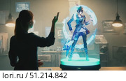A designer sketches concepts using holographic technology in a contemporary workspace lit by ambient lighting during dusk. Стоковое AI-видео, аниматор Данила Большаков / Фотобанк Лори
