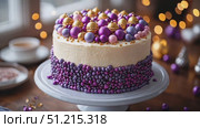 A beautifully crafted cake adorned with purple and gold embellishments is the centerpiece of a festive gathering, evoking a cheerful atmosphere. Стоковое AI-видео, аниматор Данила Большаков / Фотобанк Лори