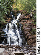 Yukankoski Waterfall (White Bridges) in the Republic of Karelia on a summer evening, Russia. Стоковое фото, фотограф Photojuli / Фотобанк Лори