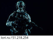 Special operations forces soldier wearing mask, armed with submachine gun, on black background. Oleg Zabielin / Stocktrek Images/TASS. Стоковое фото, агентство ТАСС / Фотобанк Лори