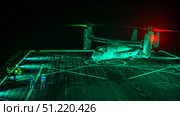 A Sailor signals to the pilot of an MV-22 Osprey during flight operations. Stocktrek Images, Inc./TASS. Стоковое фото, агентство ТАСС / Фотобанк Лори