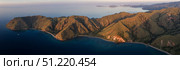 Aerial view of a rugged yet beautiful island landscape in Komodo National Park, Indonesia Ethan Daniels/Stocktrek Images/TASS. Стоковое фото, агентство ТАСС / Фотобанк Лори
