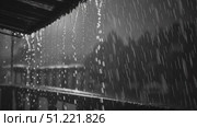 Raindrops streaming down architectural roof edge, generating dynamic water pattern with dramatic grayscale texture and soft focus background. Стоковое AI-видео, аниматор Юрий Поздников / Фотобанк Лори