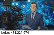 Professional news anchor presenting breaking news stories, engaging with audience and maintaining composure in front of camera against backdrop of dynamic graphics. Стоковое AI-видео, аниматор Юрий Поздников / Фотобанк Лори