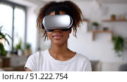 Cheery young african american lady in VR headset playing online game in virtual reality, driving imaginary car in neon light. Millennial black woman using auto simulator in cyberspace, collage. Стоковое AI-изображение, AI-художник ALLA YURTAYEVA / Фотобанк Лори