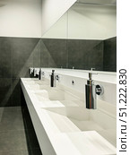 Modern Bathroom with Multiple Sinks and Mirrors. Стоковое фото, фотограф Ольга Губская / Фотобанк Лори