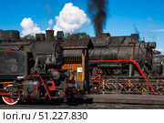 An old Soviet steam locomotive of the L series. The Ruskeala Express retro train is at the Sortavala station. Russia, Republic of Karelia, Sortavala, August 12, 2025. Редакционное фото, фотограф Photojuli / Фотобанк Лори