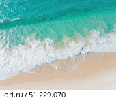 Sea wave on sandy beach. top view. place for text. Стоковое AI-изображение, AI-художник Ирина Самойлова / Фотобанк Лори