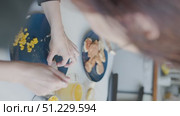 Woman carefully deboning chicken for her meal. Стоковое видео, видеограф Константин Шишкин / Фотобанк Лори